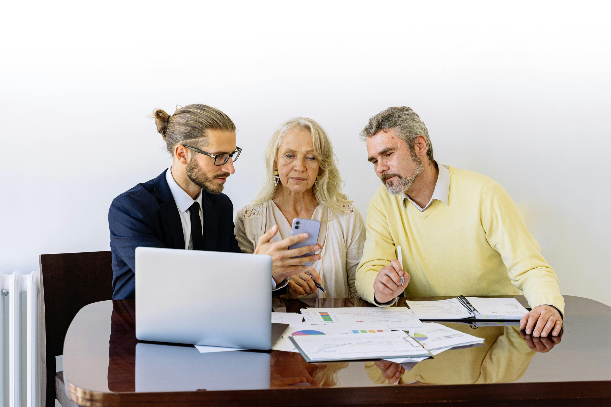 A client sitting with a UK civil litigation solicitor discussing legal documents